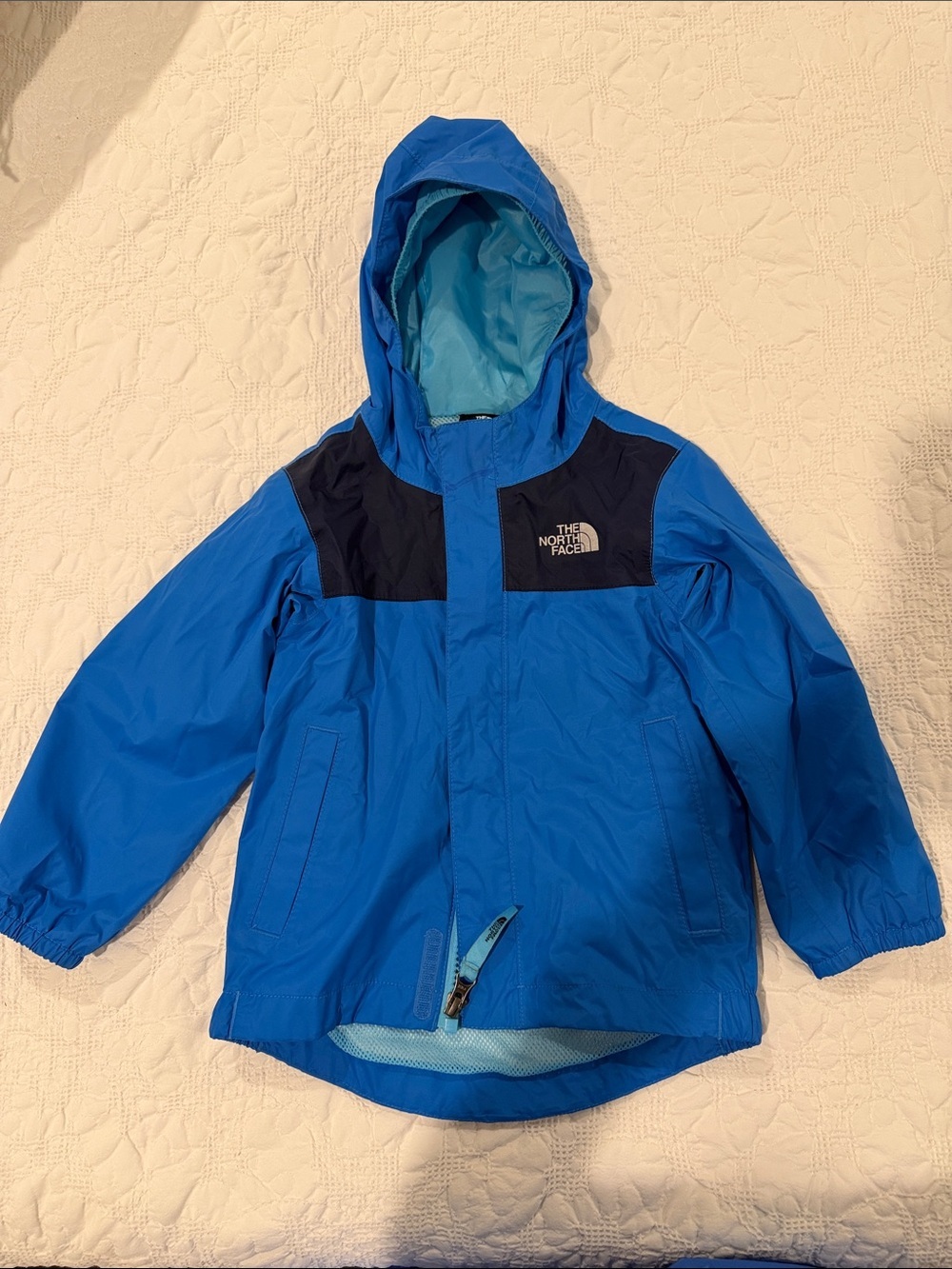 The North Face Kids Blue Hooded Rain Jacket with Navy Shoulder Panels